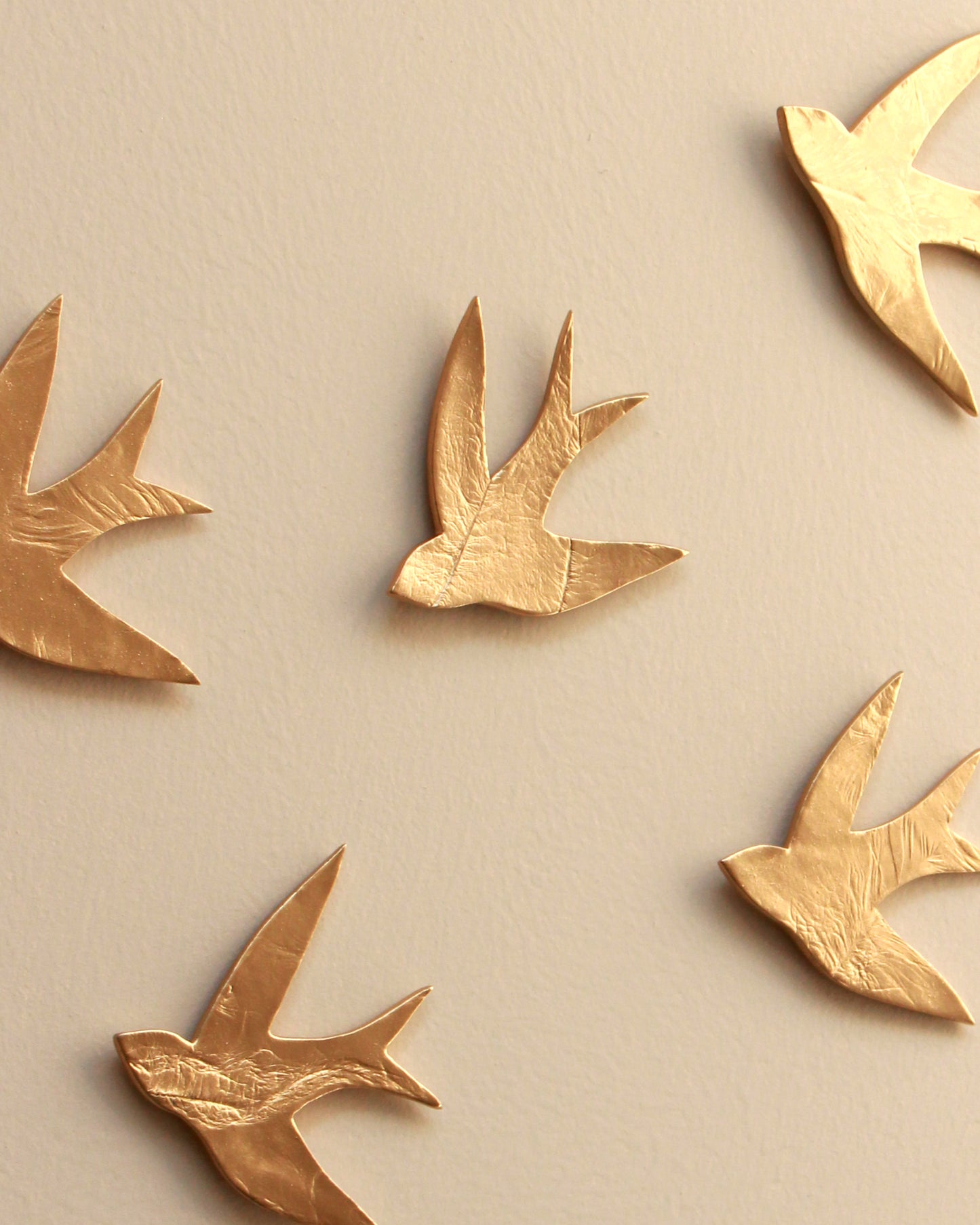 Swallows in the Sahara Gold Ceramic Swallow Wall Art, Set of 15, Handmade Pottery
