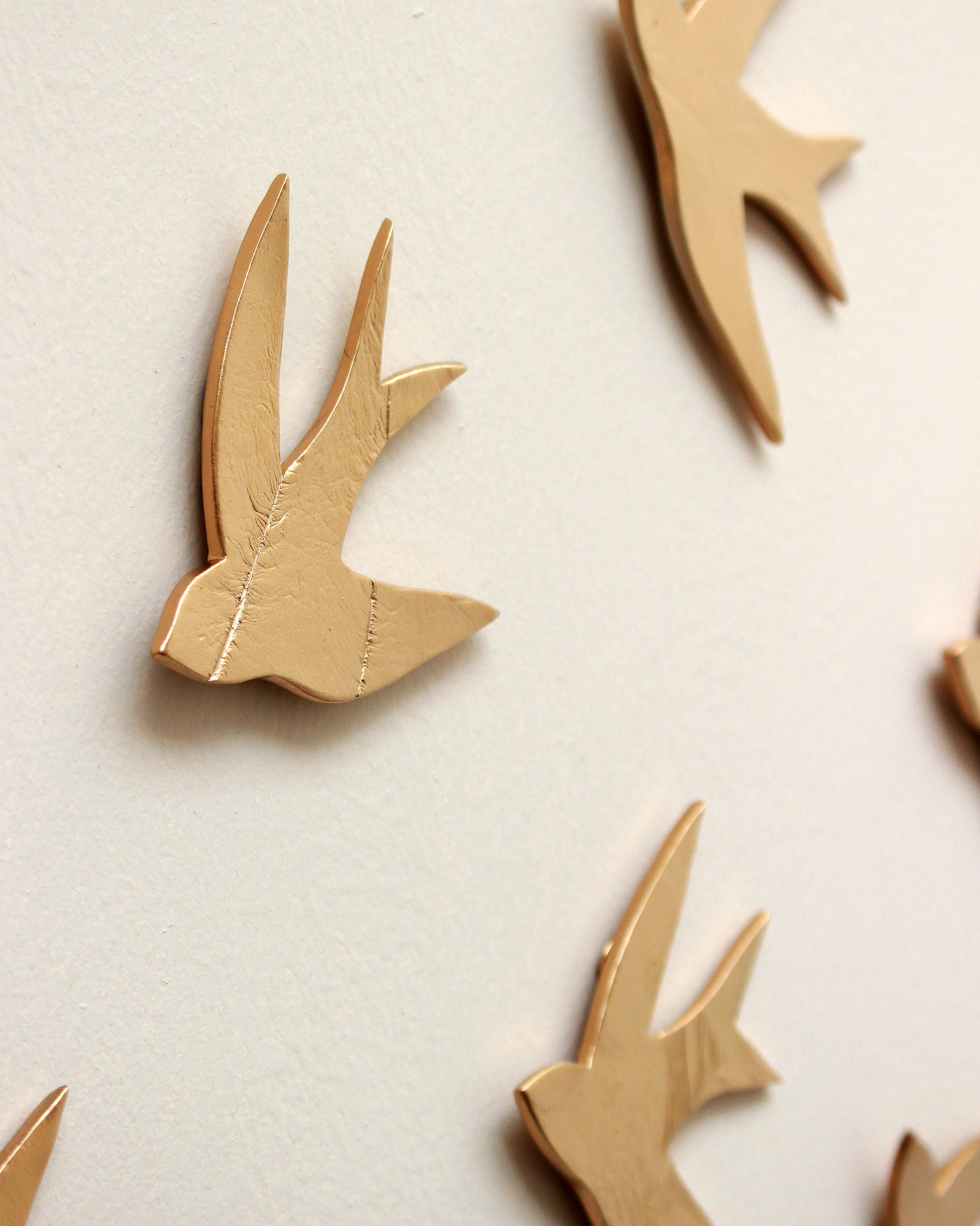 Swallows in the Sahara Gold Ceramic Swallow Wall Art, Set of 15, Handmade Pottery