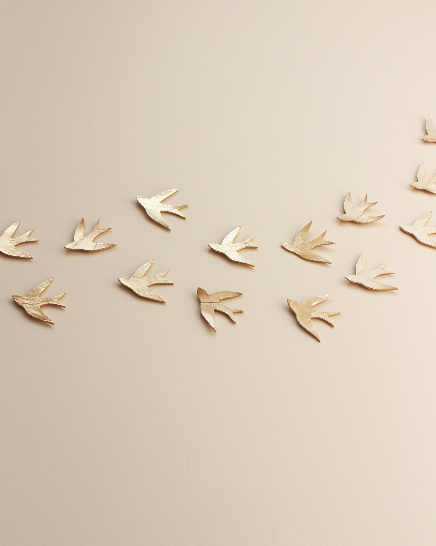 Swallows in the Sahara Gold Ceramic Swallow Wall Art, Set of 15, Handmade Pottery